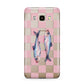 Pink Checkerboard Sardines Samsung Galaxy J7 2016 Case on gold phone