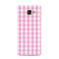 Pink Gingham Check Samsung Galaxy A3 2016 Case on gold phone