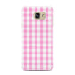 Pink Gingham Check Samsung Galaxy A7 2016 Case on gold phone