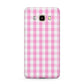Pink Gingham Check Samsung Galaxy J7 2016 Case on gold phone