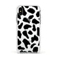 Black and White Cow Print Apple iPhone Xs Impact Case White Edge on Silver Phone