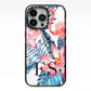 Blue Leaves Pink Flamingos iPhone 13 Pro Black Impact Case on Silver phone