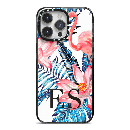 Blue Leaves Pink Flamingos iPhone 14 Pro Max Black Impact Case on Silver phone