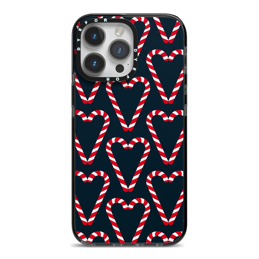 Candy Cane Pattern iPhone 14 Pro Max Black Impact Case on Silver phone