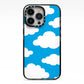Cartoon Clouds and Blue Sky iPhone 13 Pro Black Impact Case on Silver phone