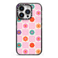 Checked flowers iPhone 14 Pro Black Impact Case on Silver phone