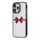 Christmas Bow iPhone 13 Pro Black Impact Case Side Angle on Silver phone