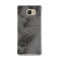 Faux Marble Grey Black Samsung Galaxy A9 2016 Case on gold phone