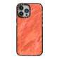 Faux Marble Red Orange iPhone 13 Pro Max Black Impact Case on Silver phone