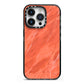 Faux Marble Red Orange iPhone 14 Pro Black Impact Case on Silver phone
