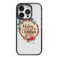 Merry Christmas Log Floral iPhone 14 Pro Black Impact Case on Silver phone