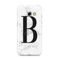 Monogrammed White Marble Samsung Galaxy A3 2017 Case on gold phone