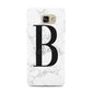 Monogrammed White Marble Samsung Galaxy A7 2016 Case on gold phone