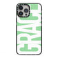 Pale Green with Bold White Text iPhone 13 Pro Max Black Impact Case on Silver phone