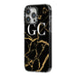 Personalised Gold Black Marble Monogram iPhone 14 Pro Max Black Impact Case Side Angle on Silver phone