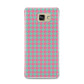 Pink Houndstooth Samsung Galaxy A9 2016 Case on gold phone