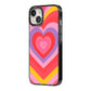 Seventies Heart iPhone 14 Black Impact Case Side Angle on Silver phone