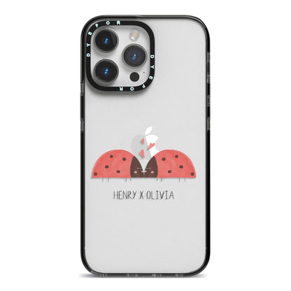 Two Ladybirds iPhone 14 Pro Max Black Impact Case on Silver phone