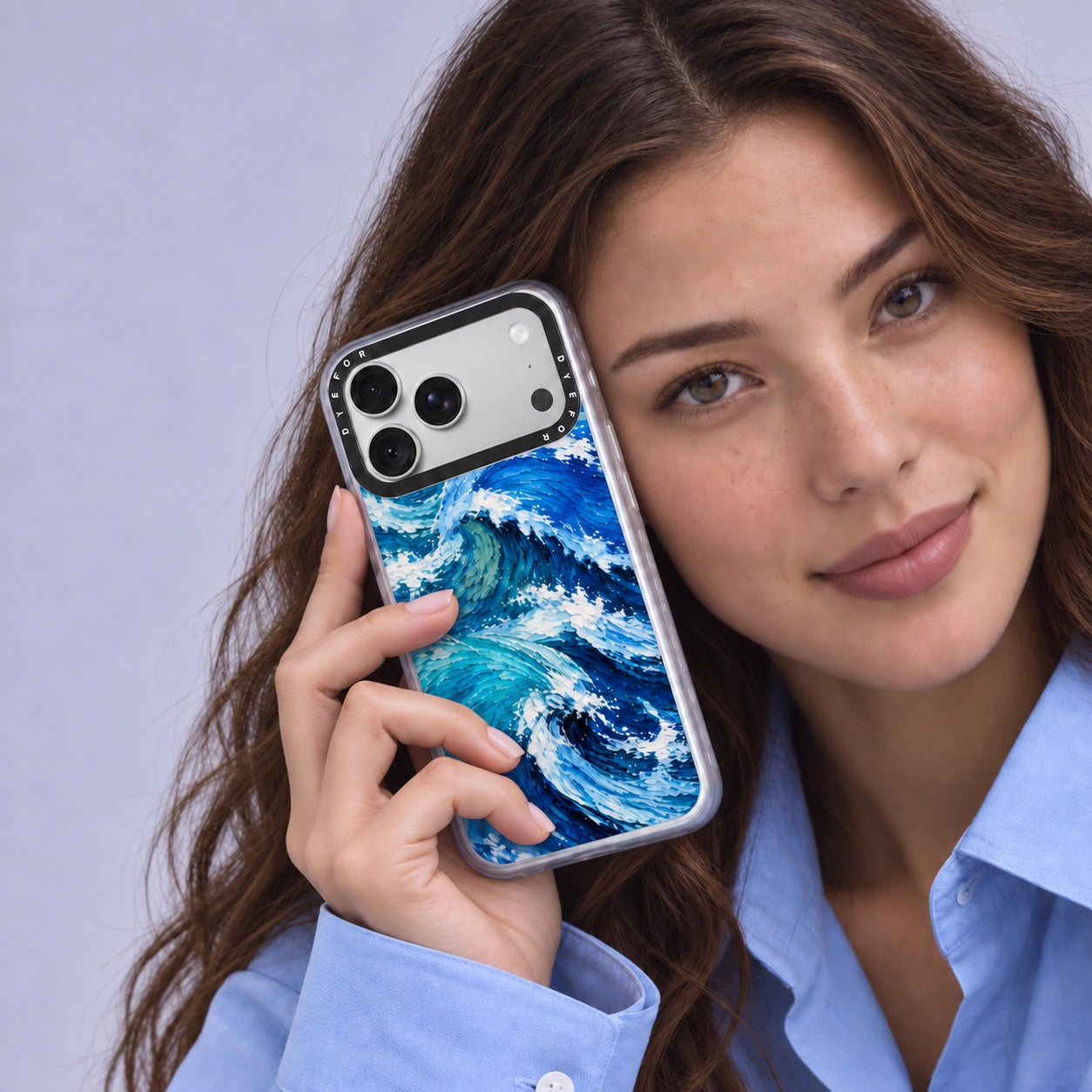Model in a blue shirt holding the Atlantic Rush DYEFOR phone case to her ear