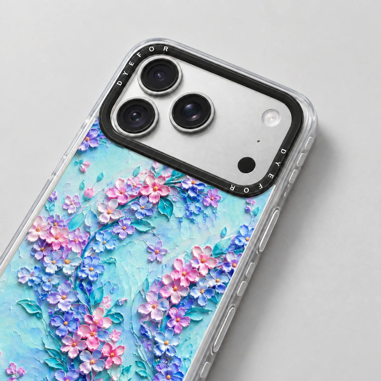 Close-up of the Petal Confetti case's raised camera surround and clear side buttons