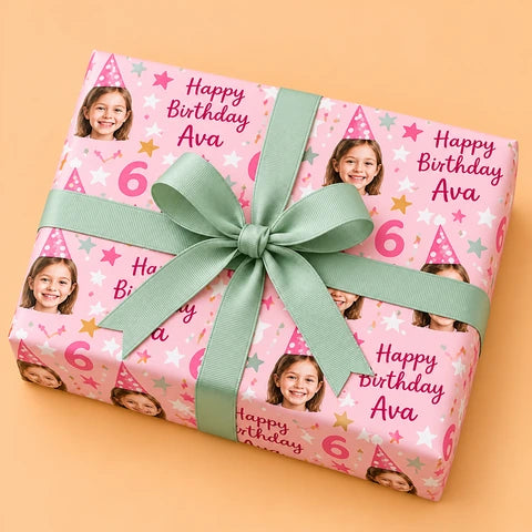 Personalised pink birthday wrapping paper with a sage grosgrain bow