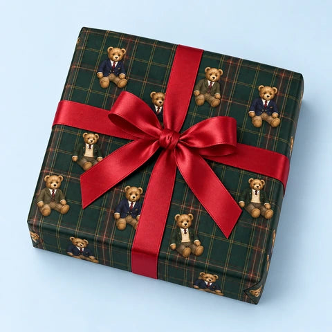 One Teddy Traditions parcel tied with a red satin bow