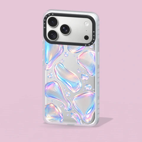 Opal Drift phone case standing on a blush studio surface
